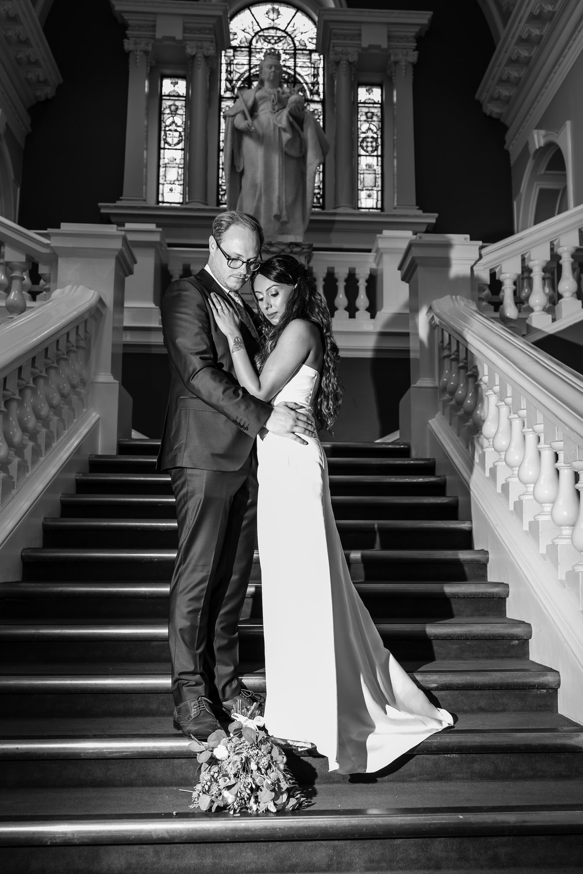 Couple standing on stairs at woolwich town hall