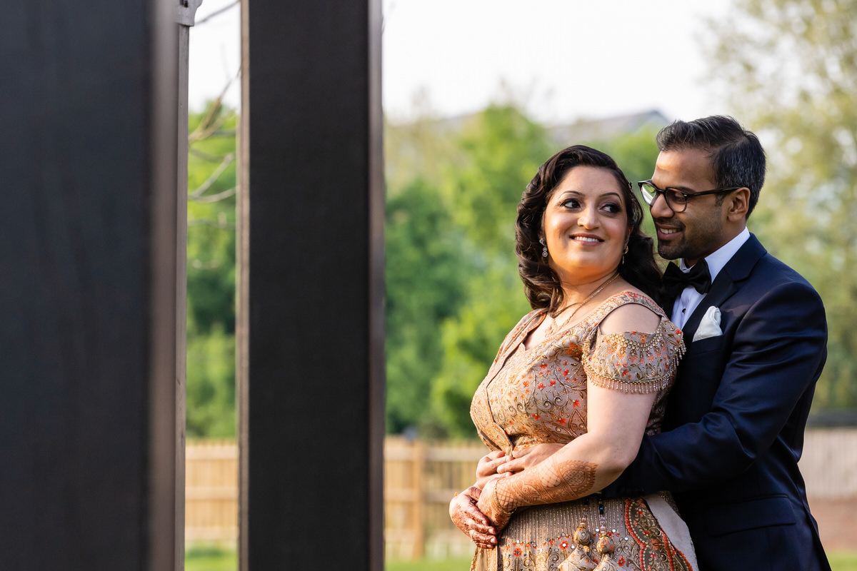 Couple posing evening reception Hilton syon park